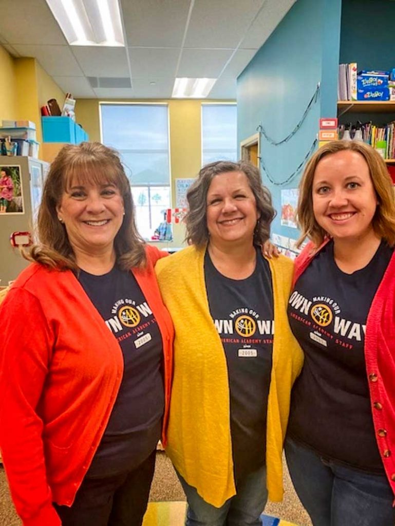 Photo of Morgan Hengsteler (far right) with fellow KindiePrep teachers Jenny Lea (middle) and classroom podmate Sarah Byrne (far left) in the classroom.