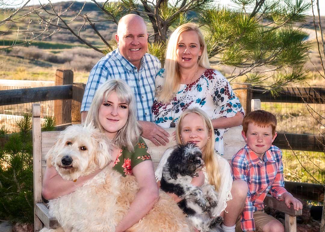 Photo of the Stotz family: Mark and Stacy, Caitlyn, Lindsey and Christian with Seymour the do.