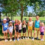 Photo of Nine young and enthusiastic girls attended cheerleading camp.