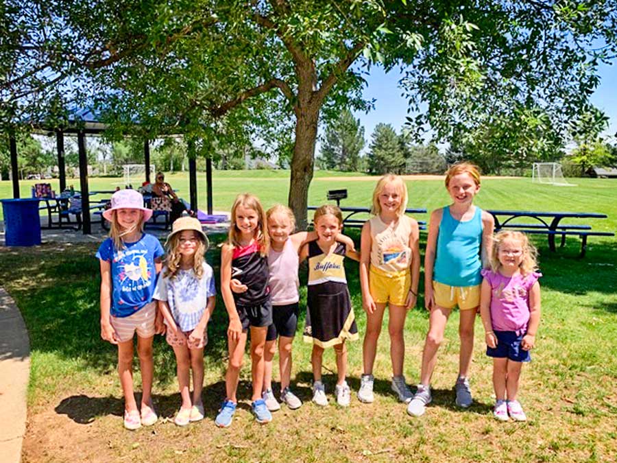 Photo of Nine young and enthusiastic girls attended cheerleading camp.