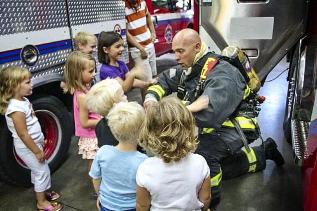 photo of first responder visiting kids
