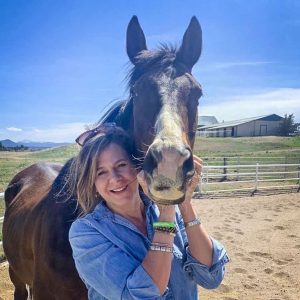 photo of woman and her horse