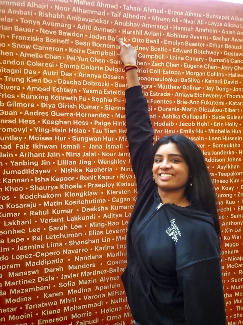 photo of talented teen pointing to her name