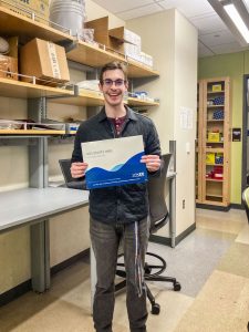 photo of student holding certificate