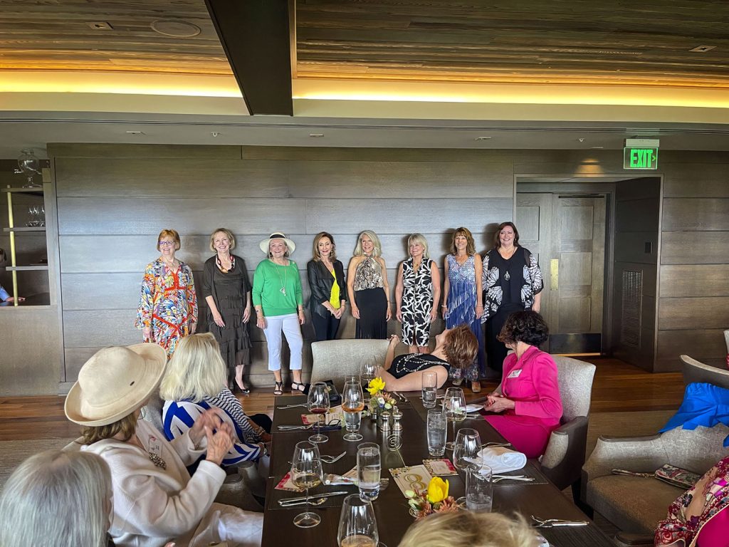 photo of women lined up in fashion show