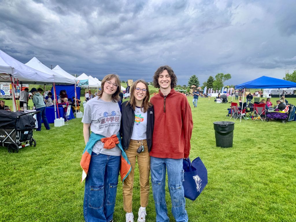 photo of three people outside