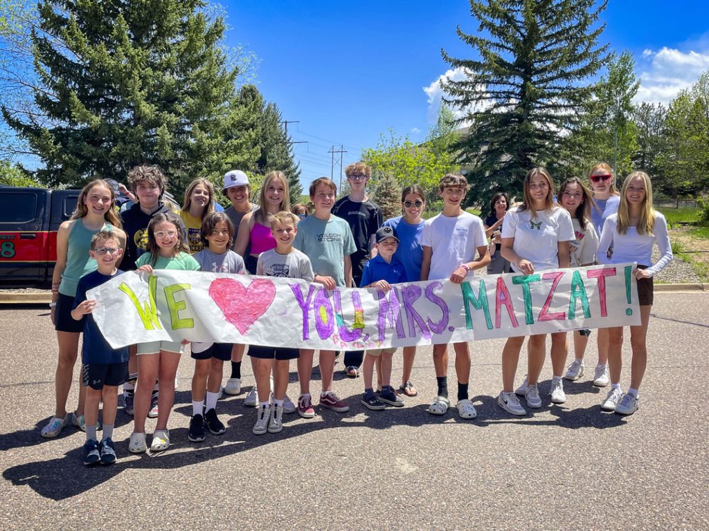 photo of students with sign