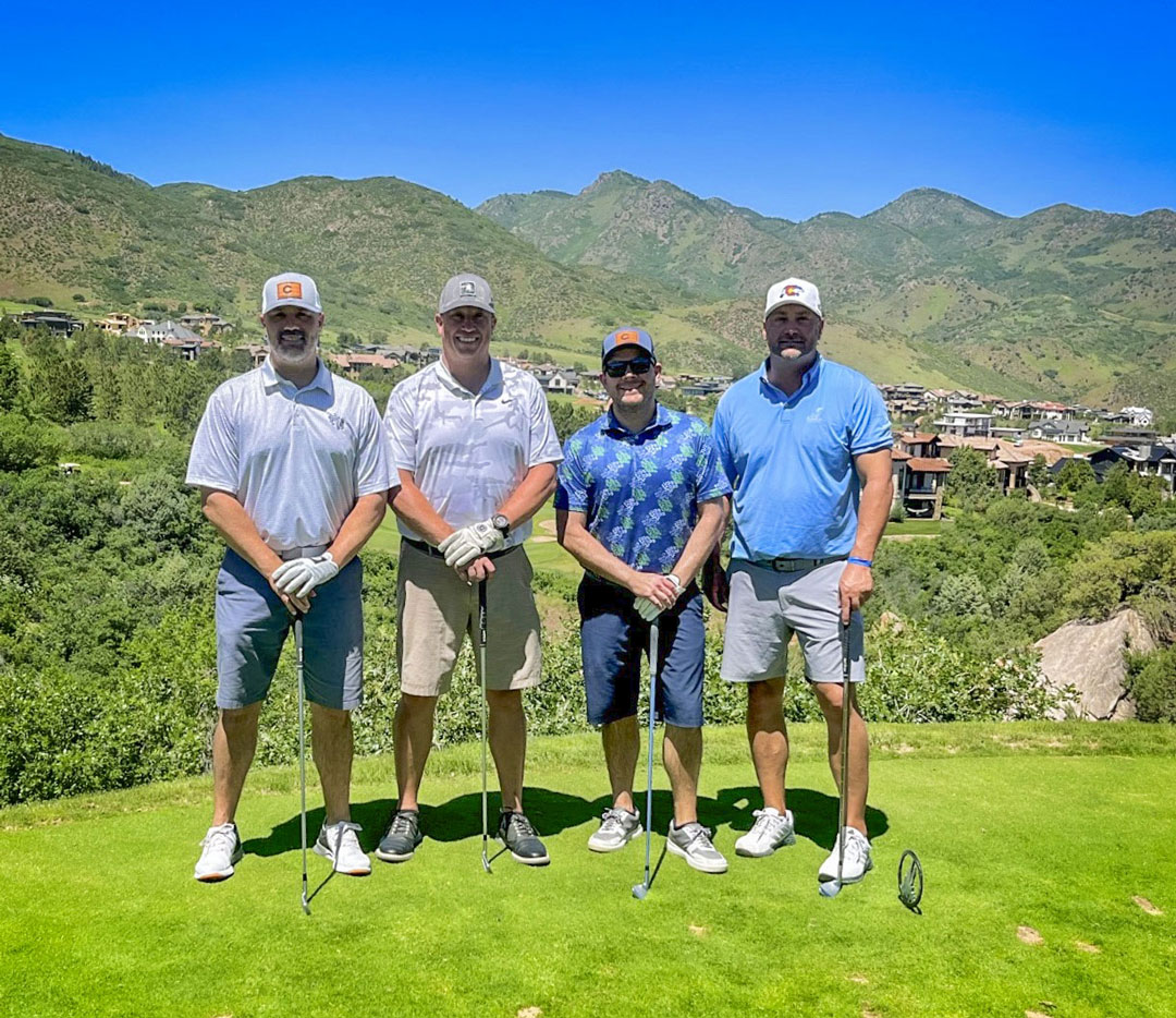 photo of 4 golfers outside