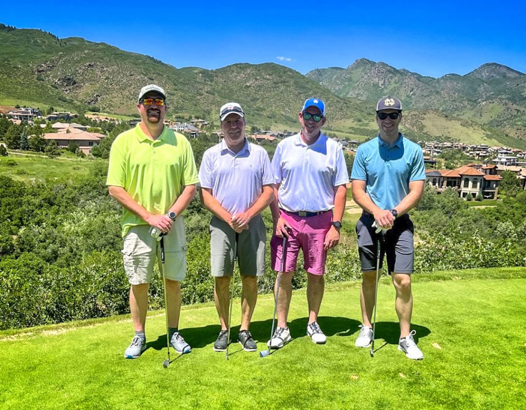 group of golfers standing ouside