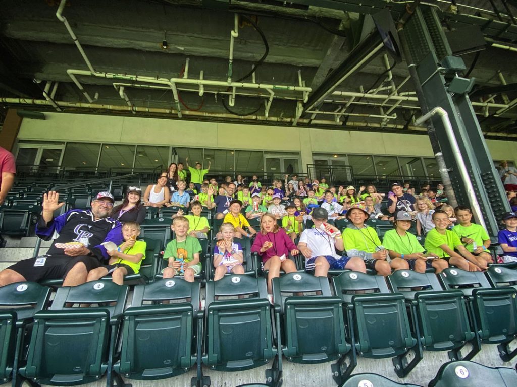 group of elementary school kids in baseball stands