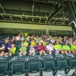 group of elementary school kids in baseball stands