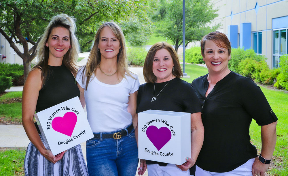 four ladies standing outside