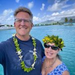 couple standing in front of ocean