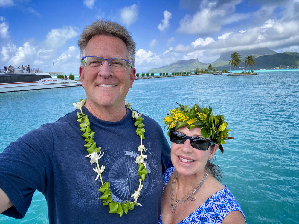 couple standing in front of ocean