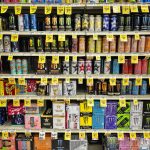 various kinds of energy drink cans on shelves