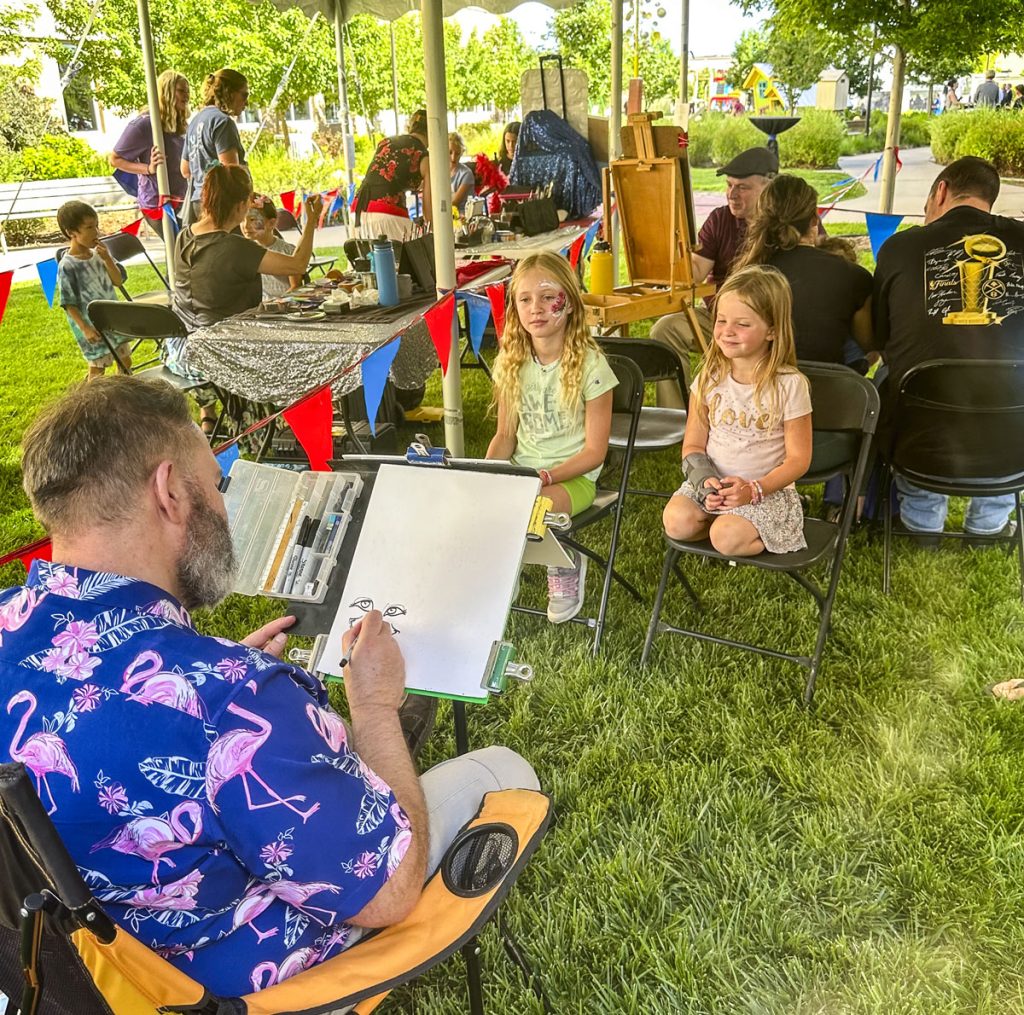 people spending time outside under tent