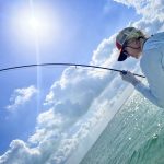 lady fishing in turquoise water