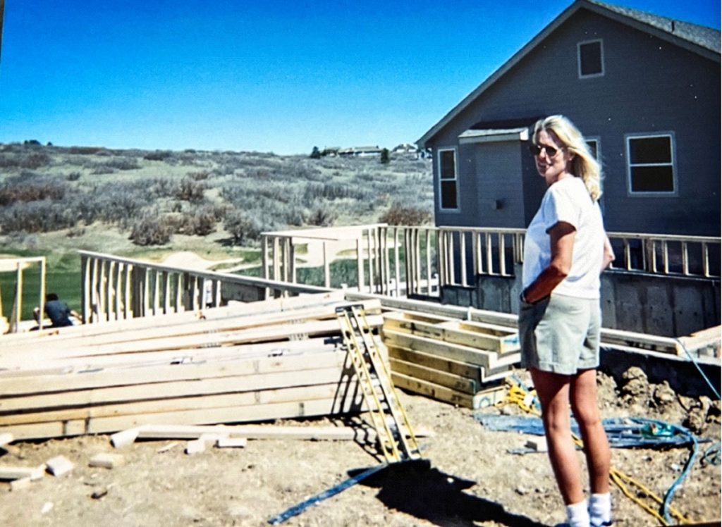 photo from 1991 of lady looking at deck being built