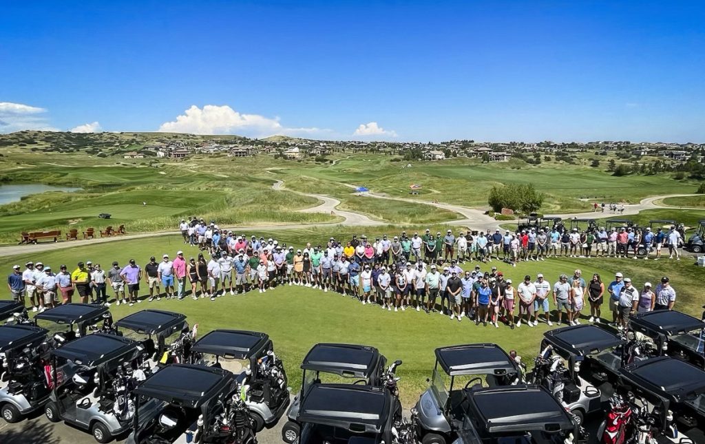 view of golfers standing in x pattern