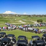 view of golfers standing in x pattern