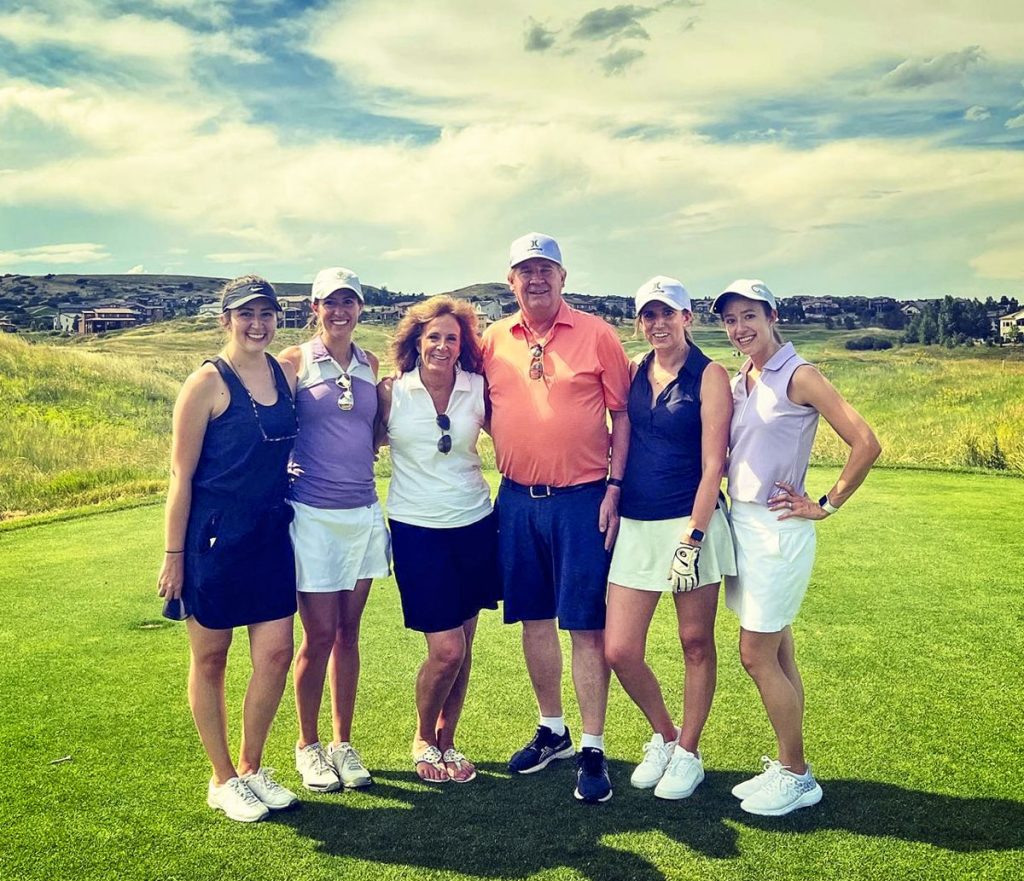 group standing on golf green