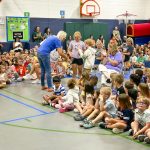 group of kids and teachers in school gym