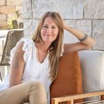 woman sitting on chair on patio