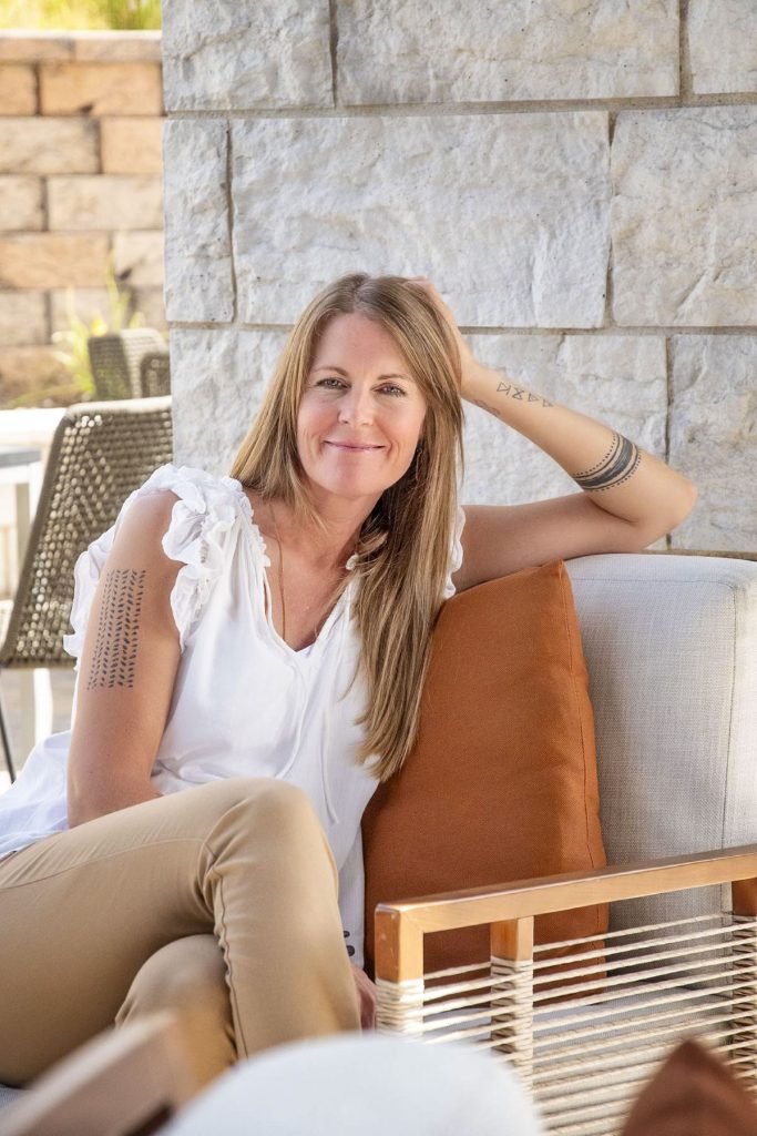 woman sitting on chair on patio