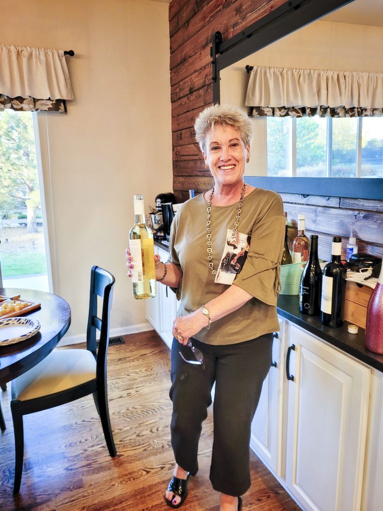 lady holding wine bottle