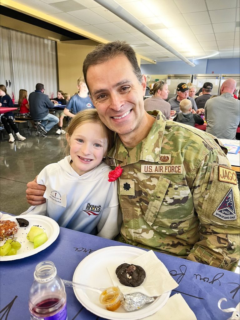 veteran in uniform with kid