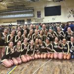 group of cheerleaders in school gym