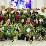 group of ladies holding wreaths