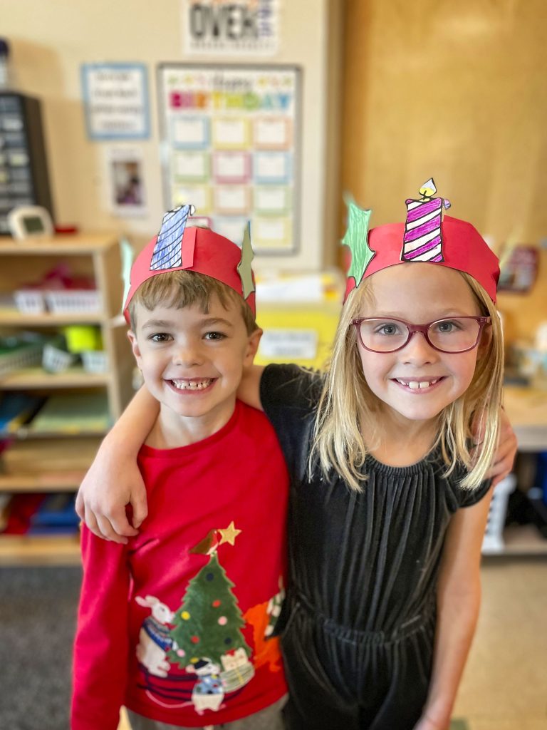 two kids with paper crowns