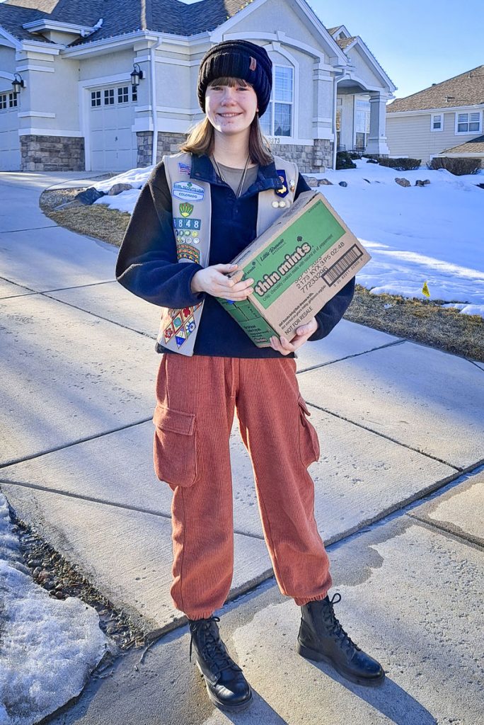 girl holding box outside