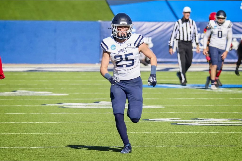 football player running on the field