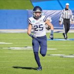 football player running on the field