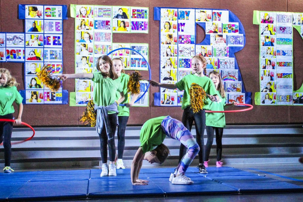 kids on stage performing different athletic feats