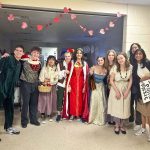 group of students in costume for play