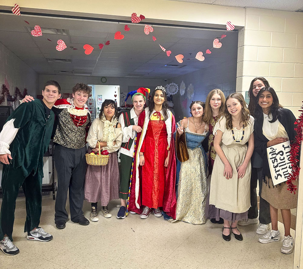 group of students in costume for play