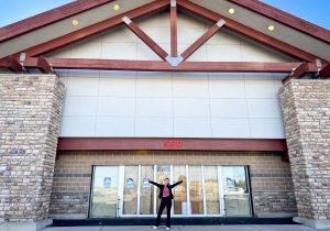 Alexis Pfeiffer stands outside the vacant building she hopes will soon be home to her new business, Engage: A Total Wellness Community.