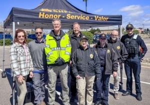 Members of the Castle Pines North Metro District Board and staff joined the Douglas County Sheriff’s Office and its Community Service Volunteer team for the prescription Drug Take Back Day in Castle Pines. Inset: Sheriff Darren Weekly.