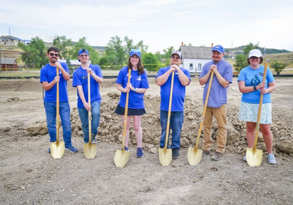 Future residents of Tall Tales Ranch stand shovel-ready at the groundbreaking for their housing facility which expected to open at the end of 2027. 