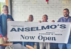 Left to right: Owner Steve LeBel, Manager Annette Smith, Kitchen Manager Gerardo Ortiz and General Manager Travis Gross celebrating the grand opening of Anselmo’s Pizzeria & Pasta.