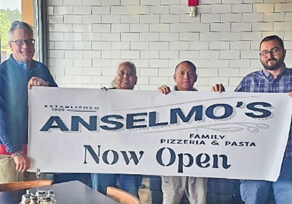 Left to right: Owner Steve LeBel, Manager Annette Smith, Kitchen Manager Gerardo Ortiz and General Manager Travis Gross celebrating the grand opening of Anselmo’s Pizzeria & Pasta.