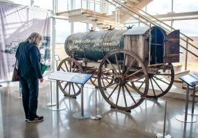 The exhibition features a historic oil wagon donated to Douglas County from a ranch in Limon. 