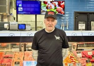 Norman Poff delivers meat counter service with a smile and a side of choice stories at King Soopers.