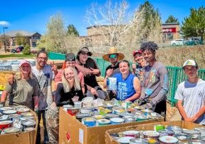 Volunteers from GreenSheen Paint stood by several boxes of the nearly 66,000 pounds of paint collected at the Castle Pines recycling event last month.