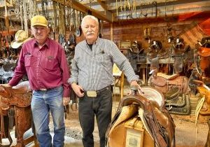 Curator Don Bailey (left) and The Village at Castle Pines resident and horse showman Dennis Niewoehner (right) at the Bailey Saddle Shop and Museum. 
