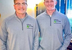 Nate (left) and Logan (right) Heflebower opened A Paws in Time in 2020 and sport their family-business jackets with pride.