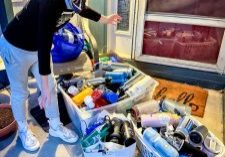 Graham Burns delivers water bottles he collected for unhoused individuals.